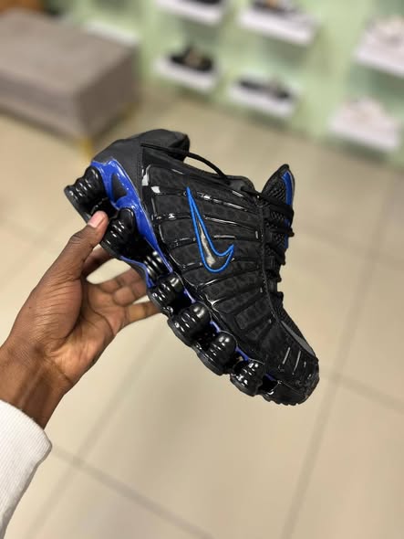 Black and blue Nike photo 1