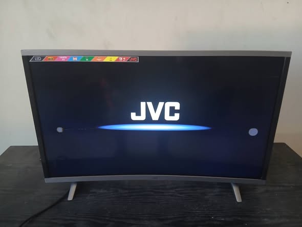 Jvc 32inch cuver TV with remote photo 1
