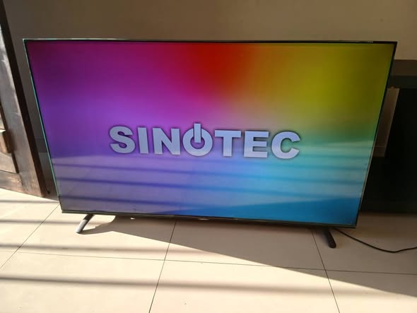 Sinotec 58inch smart TV with remote photo 1