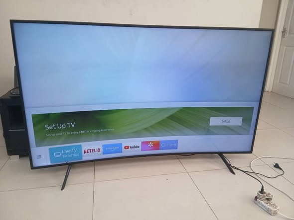 Samsung 65inch cuver smart Tv with remote photo 1