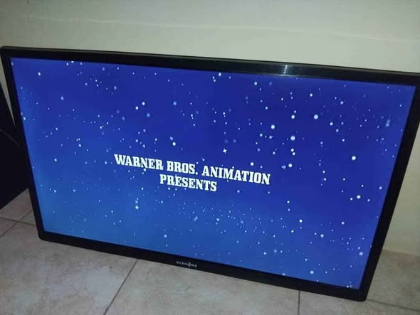 Diamond 32 inch TV with remote and papers photo 1