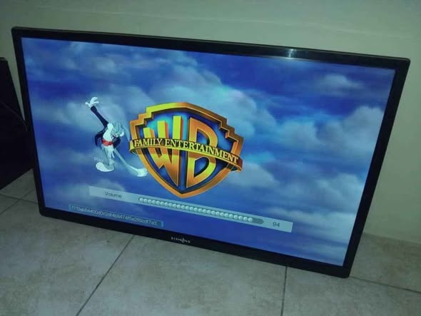 Diamond 32 inch TV with remote and papers photo 2